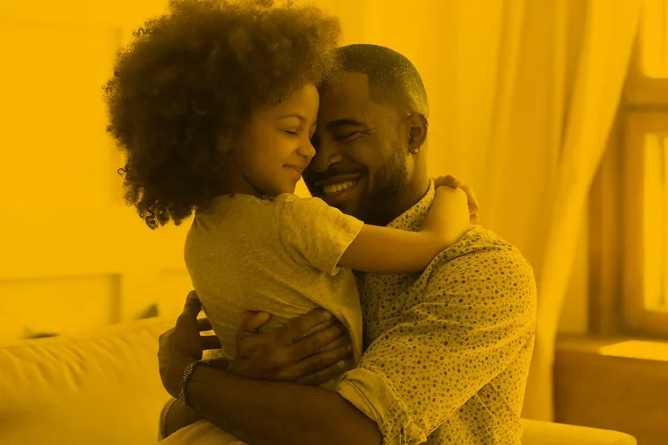 Man hugging daughter